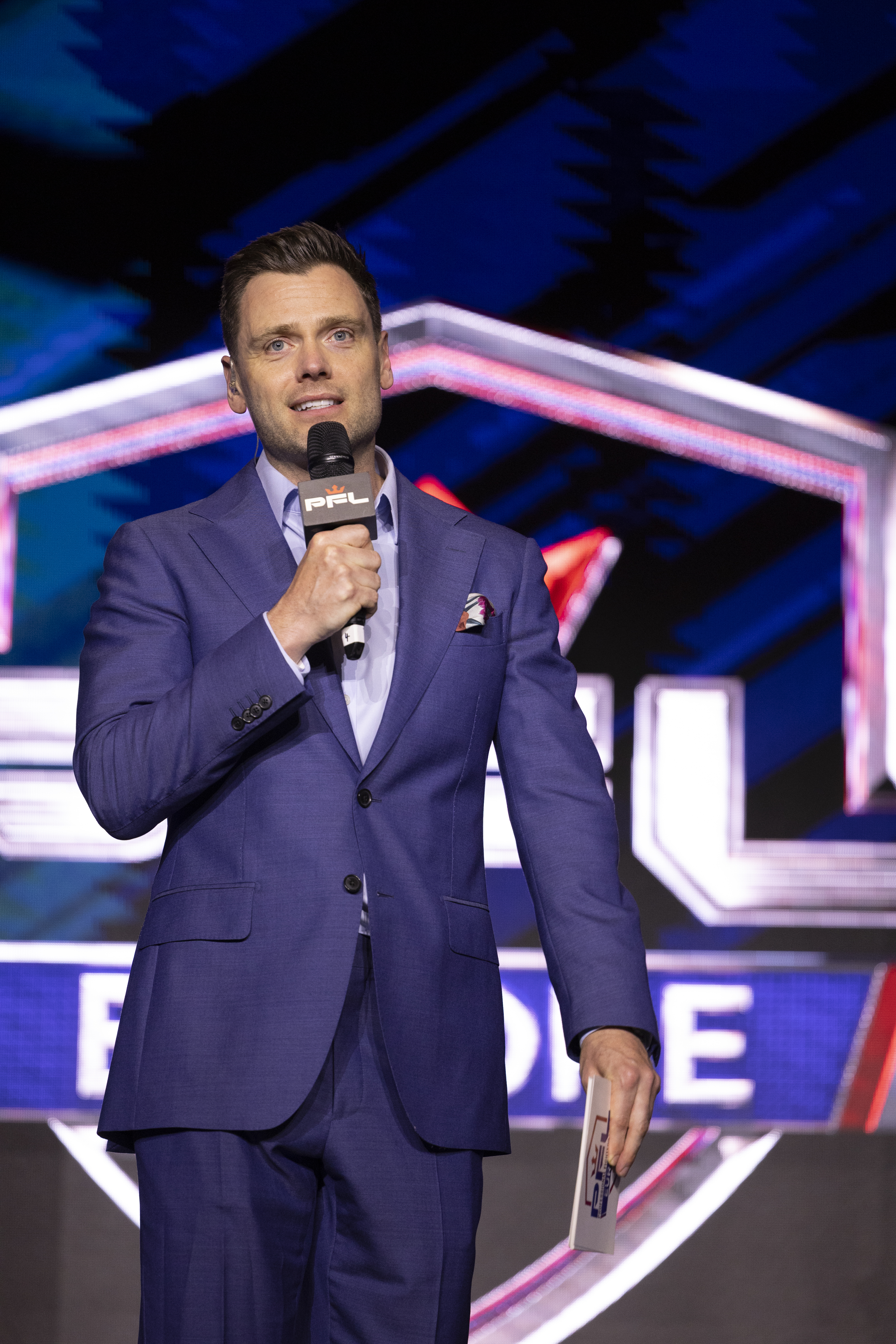 Andy Shepherd on stage hosting a PFL event